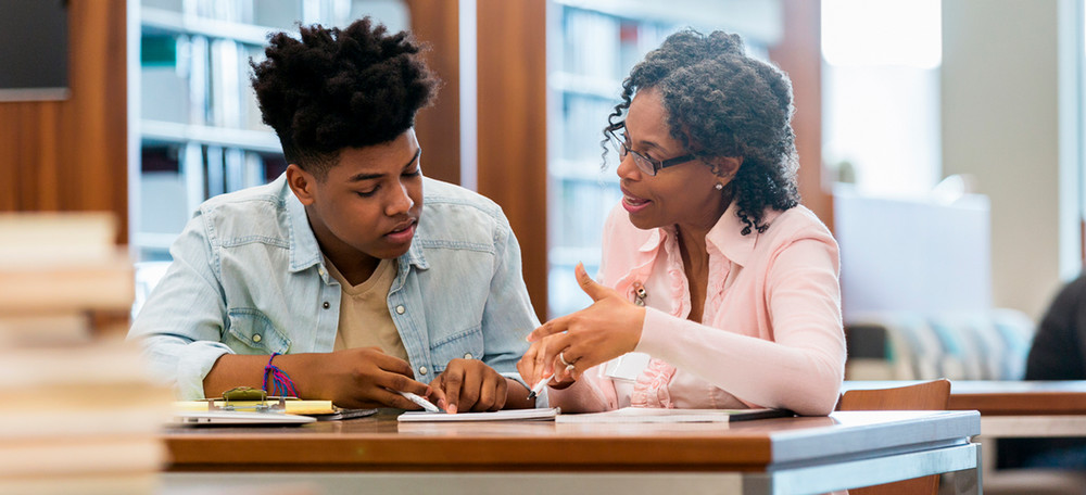 Photo of student with teacher