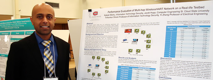 Minnesota State undergraduate student with scholarly research poster