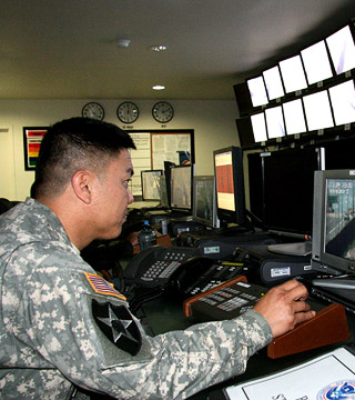 Service member working at a video editing workstation