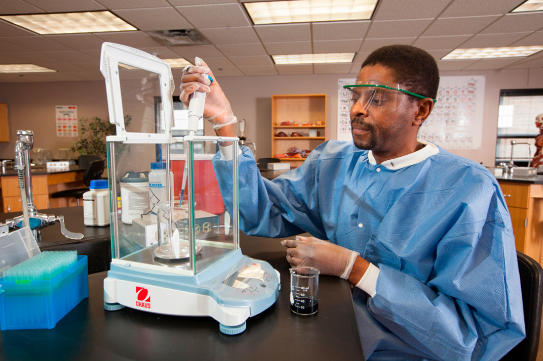 Image of student measuring reagent 