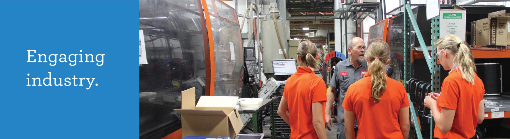 Engaging industry. College students touring a warehouse