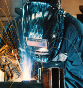 person  welding with mask on