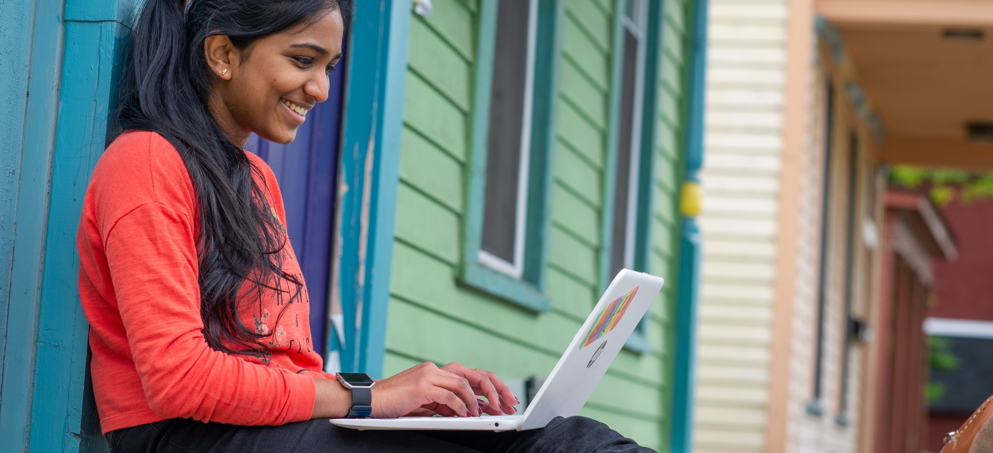 Student studying outside their home