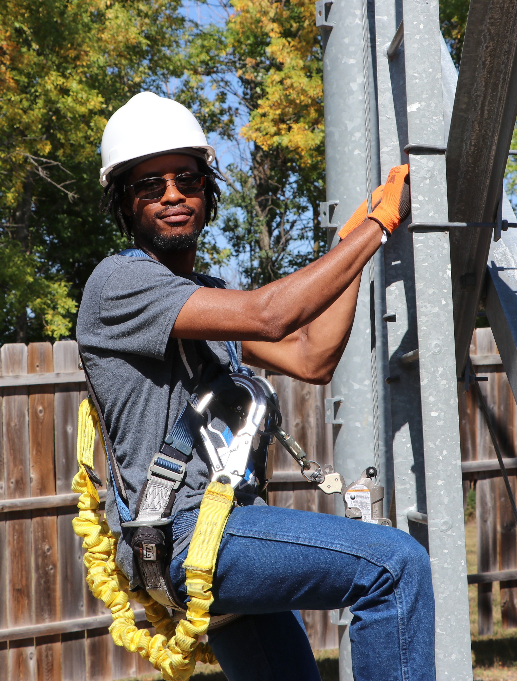 Worker Climbing Power Pole