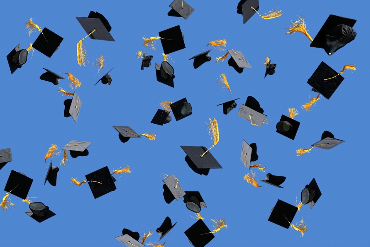 Graduation caps in the sky