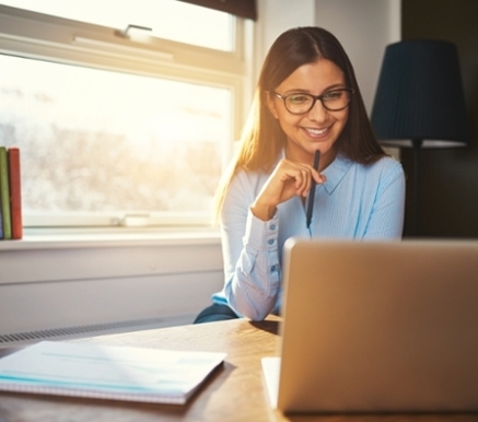 Woman in office sitting in front of computer